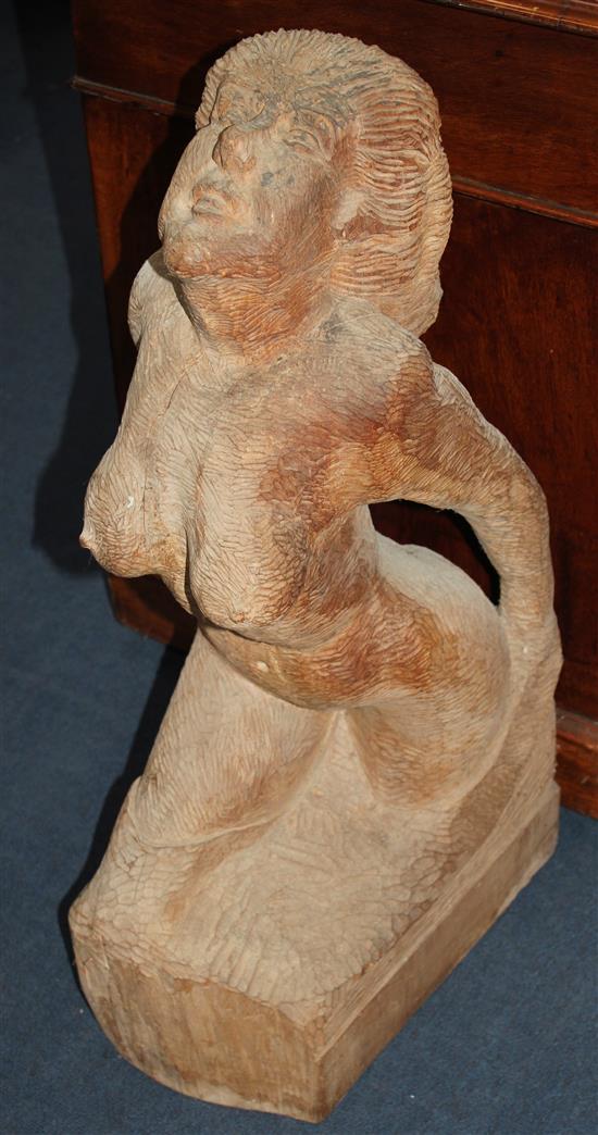 Cyril Saunders Spackman (1887-1963). A 20th century wood carving of a kneeling nude woman, 31.5in.